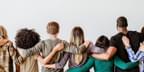 Diversity group of people embracing back view