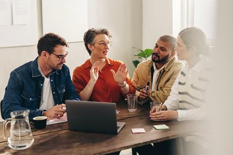 Team collaborating in meeting room